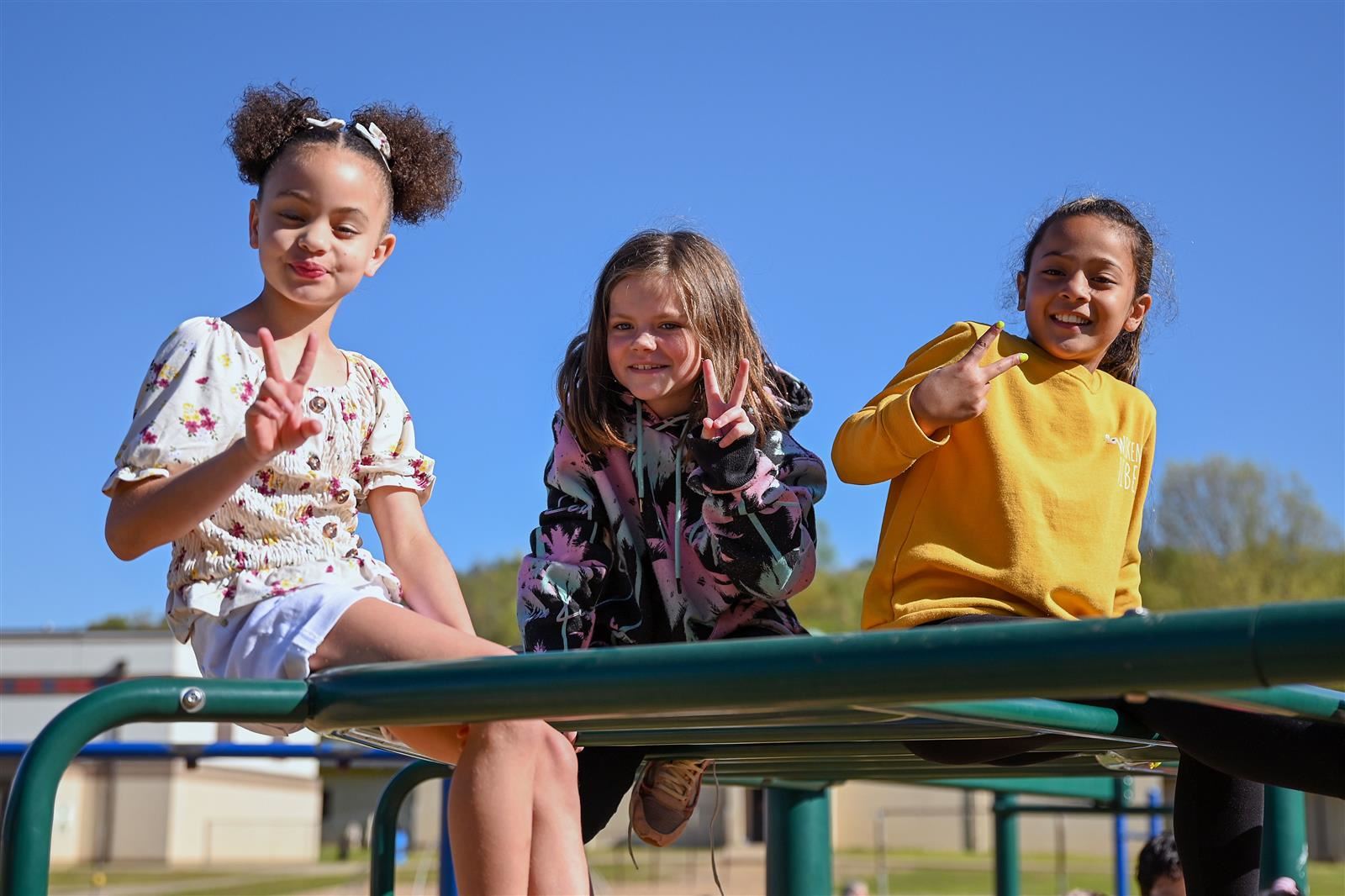 little girls on monkey bars